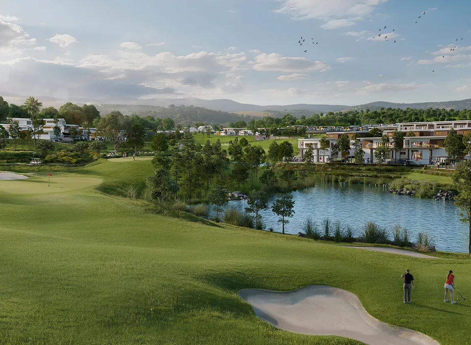 Golf fairway and lake framed by villas and hills at The Jembrana Estate